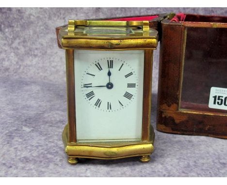 An Early XX Century French Brass Cased Carriage Clock, the white enamel dial with black Roman numerals, the backplate inscrib