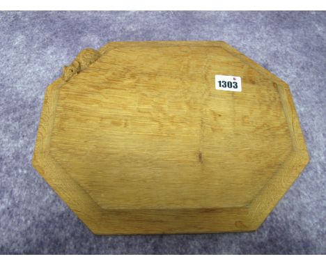 A Robert Thompson 'Mouseman' Oak Bread Board, of elongated octagonal form, with carved mouse signature, 25 x 30cm.