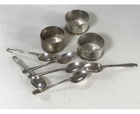 A set of six silver teaspoons, pair of silver napkin rings and a silver napkin ring 