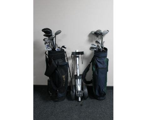 Two golf bags containing Howson irons and assorted drivers, folding golf trolley 