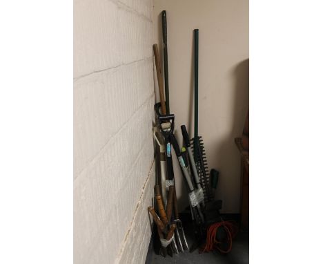 A quantity of assorted garden tools, hedge trimmer etc 