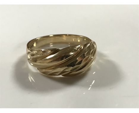 A 9ct gold textured ring, 3.1g, size O/P.