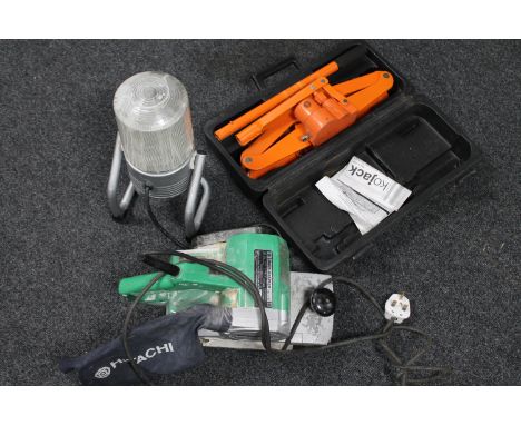 A box of Hitachi SB 110 belt sander, cased trolley jack and a garage work light 