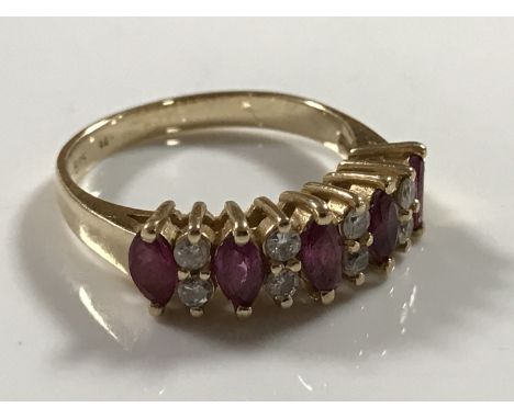 A 14ct gold five stone diamond and ruby ring, 2.9g, size K.