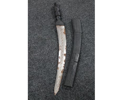An African sword in leather scabbard 