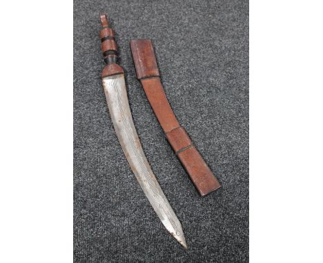 An African sword in leather scabbard 