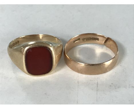 A gent's 9ct gold signet ring and a 9ct gold wedding band (cut) CONDITION REPORT: 7.3g gross. 