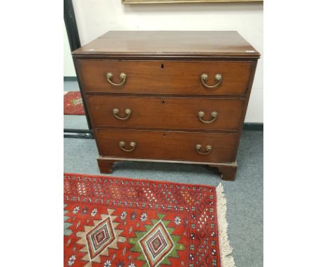 A George III mahogany three drawer chest on bracket feet, width 95 cm.