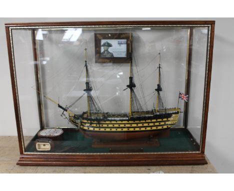 A 1/100 scale model HMS Victory in display case built 1983/84 by S.R.Ashton esquire. CONDITION REPORT: The case measures 110c