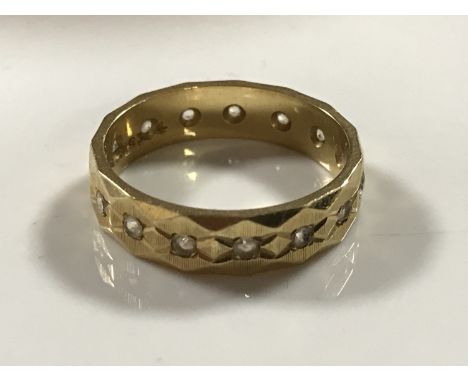 A 9ct gold diamond set eternity ring, 4.2g, size M.