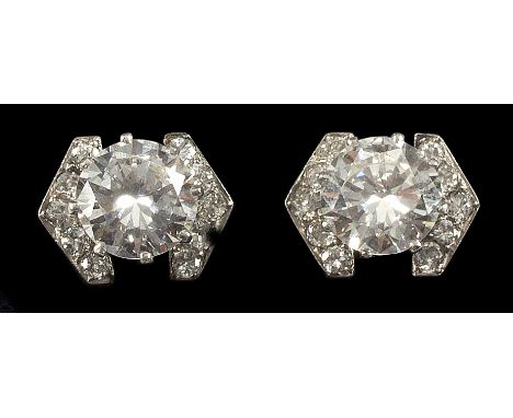 A pair of diamond ear studs, each with central stone of approximately 1.75ct flanked by a V shaped line of five diamonds to e