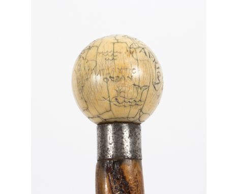 A spirally ribbed walking stick, the ivory ball handle engraved a map of the world/see illustration Condition Report: Lot con