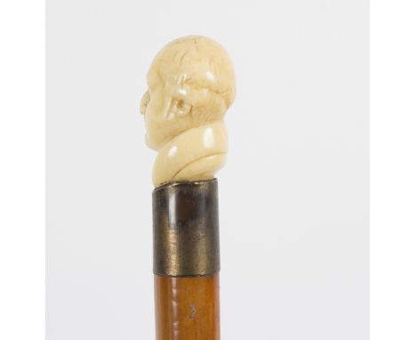 A walking stick with carved ivory handle in the form of a bust of a Victorian gentleman Condition Report: Lot contains an ele