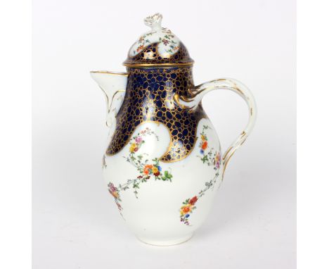 A Meissen coffee pot and cover, of ogee form, painted flower sprigs on a blue and gilt ground, flower finial and entwined bra