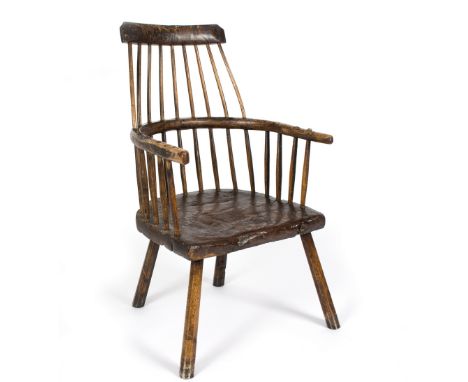 An 18th Century comb-back chair in ash and elm/Provenance: Robert Young/see illustration Condition Report: Comb back a little