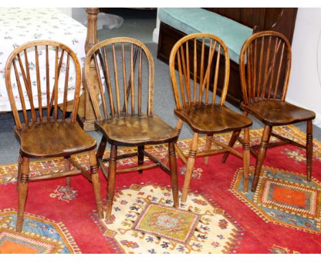 A set of five Windsor stick-back chairs, mostly stamped including Hearn Bros.