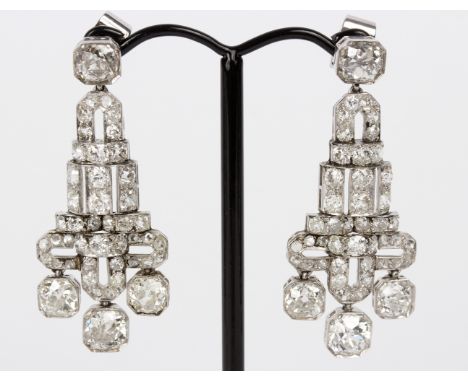 A pair of Art Deco diamond ear pendants, of geometric form set in unhallmarked white metal, 4.5cm long/see illustration/Prove