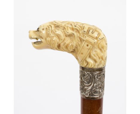 A walking stick, the carved ivory spaniel head handle with embossed mount/see illustration Condition Report: Lot contains an 