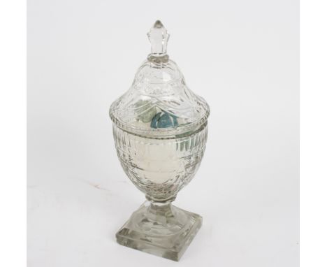 A cut glass bonbonnière and cover, of vase shape, 31cm high, containing a quantity of mineral eggs Condition Report: Lot 294: