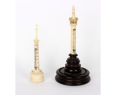 An ivory cased thermometer in the form of a minaret with engraved centigrade and fahrenheit gauge on a hardwood stand, 21.5cm