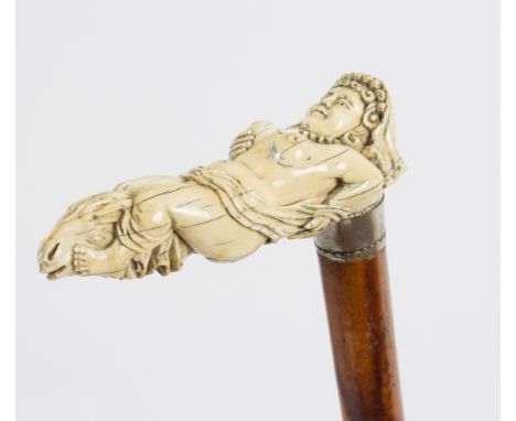 A walking stick, the carved ivory handle in the form of a recumbent nude/see illustration Condition Report: Lot contains an e