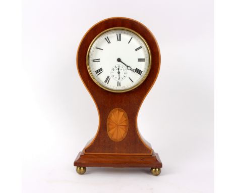 An Edwardian mahogany eight-day alarm mantel clock, in a balloon shaped case inlaid an oval patera, on brass ball feet, 19cm 