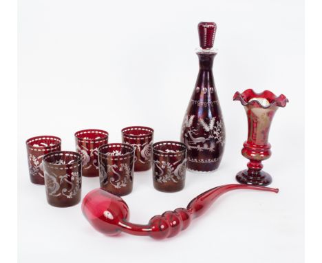 A Bohemian red glass decanter and stopper decorated a leaping stag, 33.5cm high and six matching glasses, a Bohemian glass va