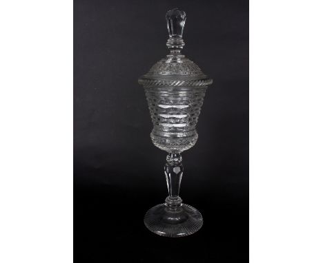 A cut glass goblet and cover, 19th Century, the thistle shaped bowl with honeycomb and diamond cutting, facet cut finial and 