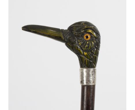 A malacca walking stick with carved stained ivory handle in the form of a duck's head, with initialled silver mount Condition