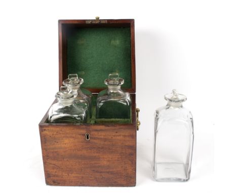 A fitted Georgian mahogany decanter box, including four original hand blown decanters, 23cm wide Condition Report: One bottle