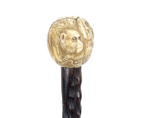 A Japanese walking stick, the ivory ball handle carved in the form of monkeys/see illustration Condition Report: Lot contains