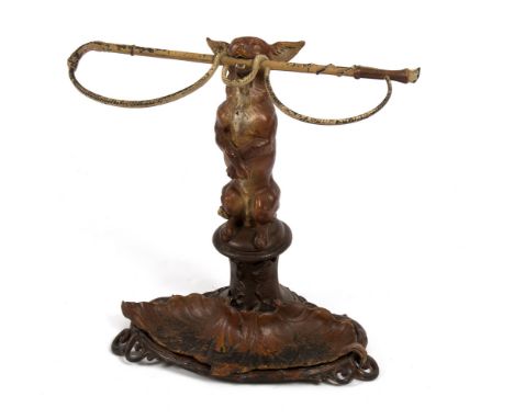 A painted cast iron stick stand, a fox supporting a whip, 61cm high/see illustration