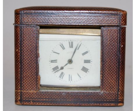 A mid-20th century brass cased carriage clock, having enamelled dial with Roman numerals, visible platform lever escapement, 