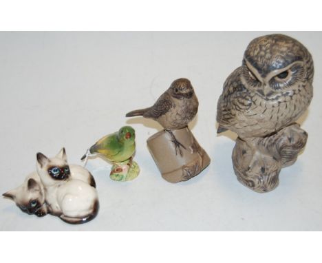 A Poole pottery model of an owl, printed mark verso and inscribed B Linley Adams; together with a Poole pottery figure of a R