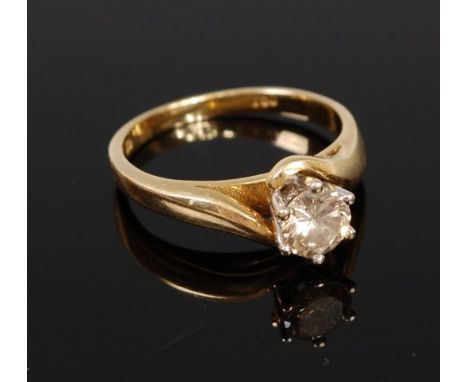 An 18ct gold diamond solitaire ring, the claw set brilliant weighing approx 0.6ct, 3.8g, size K