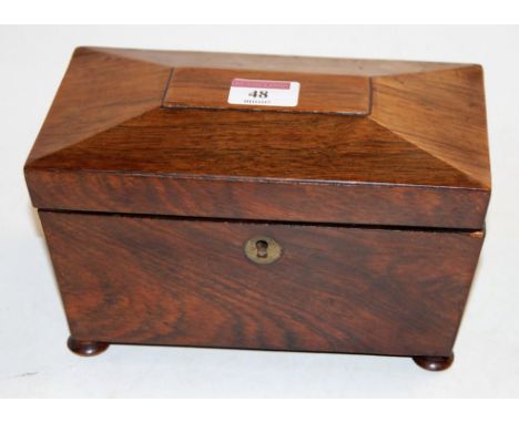 An early Victorian rosewood tea caddy, of sarcophagus form on bun feet, w.20cm