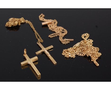 An 18ct gold cross pendant 4.2g, together with 9ct gold crucifix pendant on finelink neck chain, two other 9ct gold necklaces