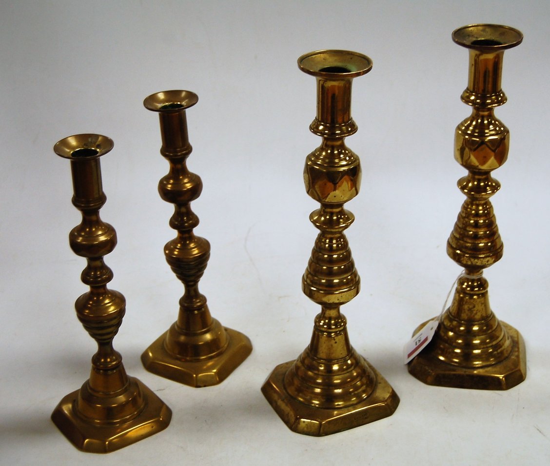 A pair of 19th century turned brass candlesticks, stamped England and