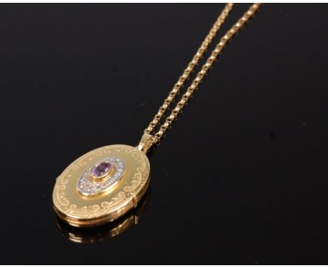 A Victorian style 9ct gold picture locket, centre set with an oval cut amethyst, 2.7cm, on 9ct gold finelink neck chain, gros