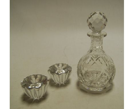 A pair of boxed Orrifors of Sweden glass candle-holders; together with a small Royal Doulton cut crystal decanter and stopper