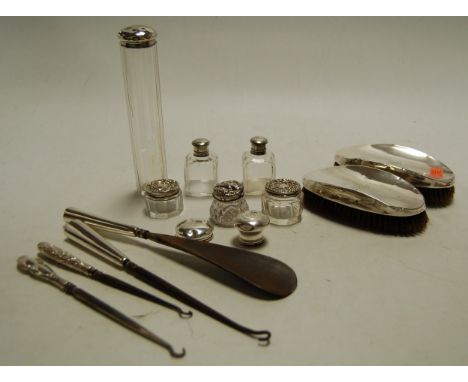 A quantity of various silver mounted dressing table wares to include clothes brushes, hat pin jar, scent bottles, button hook