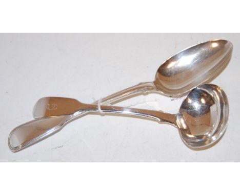 A George IV silver stuffing spoon; together with a George V silver ladle (2)