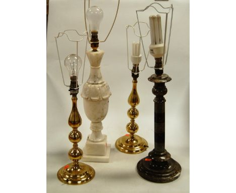 A large marble pedestal table lamp; together with one other similar; and a pair of turned brass table lamps, each with pleate