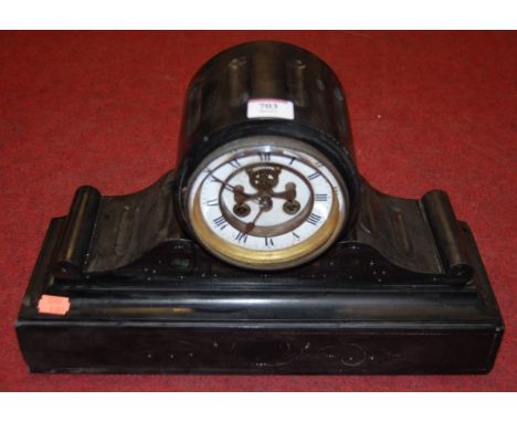 A circa 1900 black slate drum shaped mantel clock, having enamelled chapter ring with Roman numerals and cylinder movement