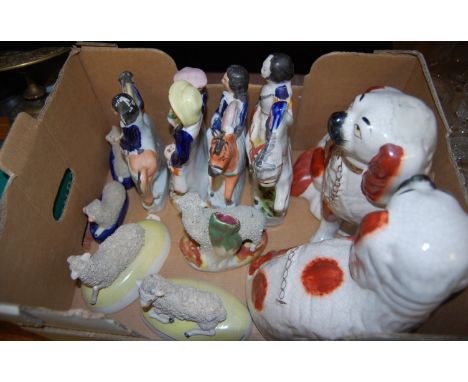A collection of Victorian and later Staffordshire figures, to include; pair of seated spaniels, The Duke of Cambridge, recumb