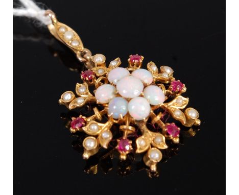 A 9ct gold opal ruby and seed pearl set snowflake pendant, 2.7g, dia. 2.5cm