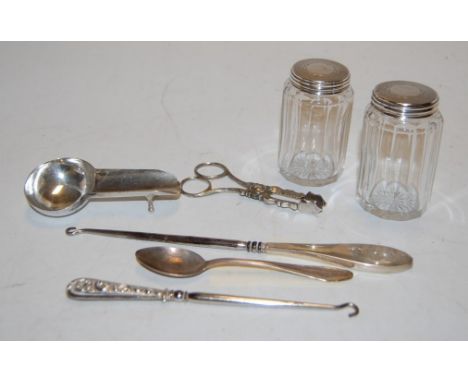 Assorted silver wares to include button hook, sugar bows, dressing table bottles, etc