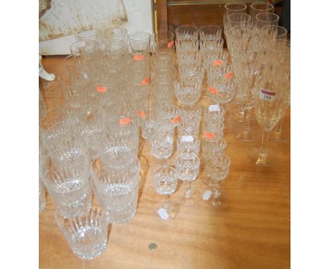 A large collection of cut glassware to include a set of 6 Waterford champagne flutes etc
