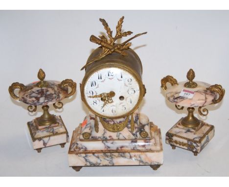 A late 19th century French brass cased drum shape mantel clock, having enamel dial with Arabic numerals surmounted by a bow w