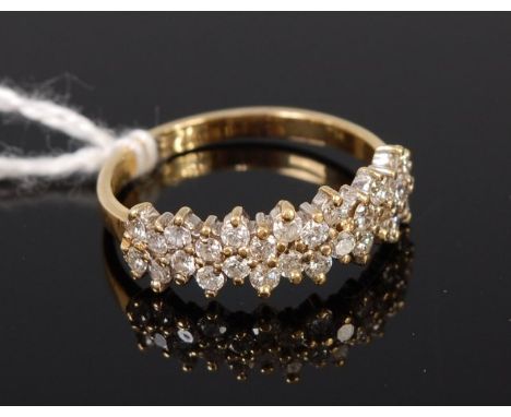 An 18ct gold diamond half eternity ring, arranged as fourteen pairs of small brilliants, total diamond weight approx. 0.42ct,